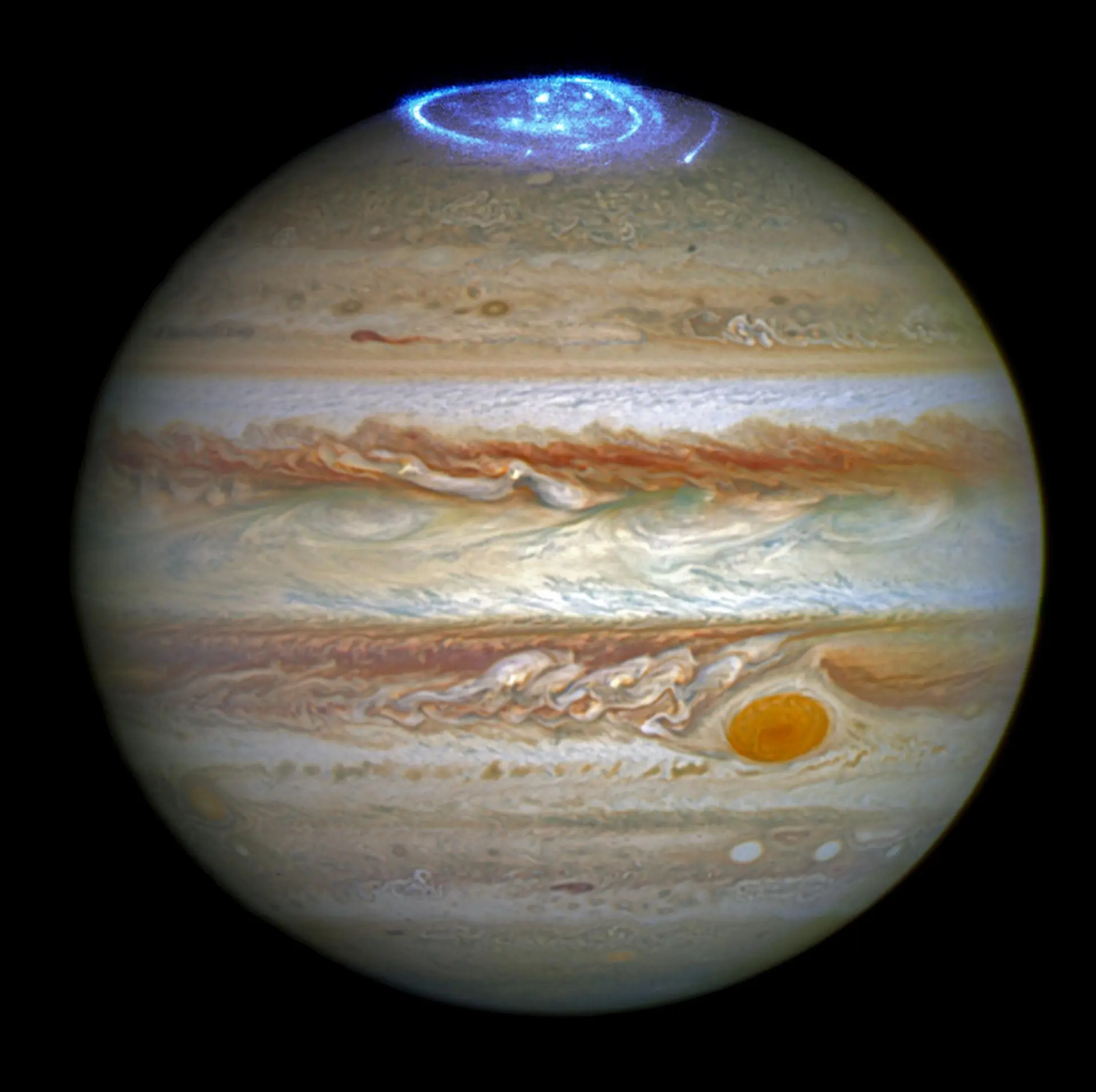 Jupiter showing bright auroras near its north pole captured by the Hubble Space Telescope